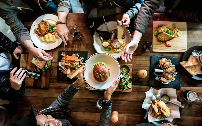 A group of friends enjoying a meal together at a restaurant